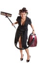 Angry housewife with a vacuum cleaner