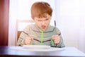 Angry hungry boy child waiting for dinner Royalty Free Stock Photo