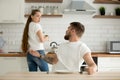 Angry husband and shocked wife arguing having conflict in kitche Royalty Free Stock Photo