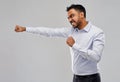 Angry indian businessman fighting over grey