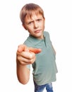 Angry kid boy shows his finger to screen evil is Royalty Free Stock Photo