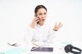 Angry lady boss, businesswoman looks frustrated, talks on mobile phone, has an argument during conversation on cellphone Royalty Free Stock Photo