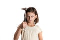 Angry little girl holding a socket wrench