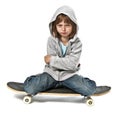 Angry little girlsitting onskateboard