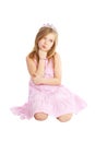 Angry little princess sitting over white Royalty Free Stock Photo