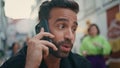 Angry macho arguing cellphone call city bar closeup. Nervous man calling phone Royalty Free Stock Photo