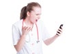 Angry mad doctor or medic woman yelling at phone Royalty Free Stock Photo