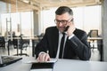 Angry mad frustrated businessman talking on phone complaining on bad service solving business corporate problem, annoyed Royalty Free Stock Photo