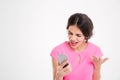 Angry mad young woman shouting and using mobile phone Royalty Free Stock Photo