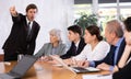 Angry male boss reprehending colleagues on meeting in office Royalty Free Stock Photo