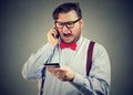 Angry man arguing on smartphone Royalty Free Stock Photo