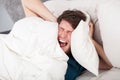 Angry man awoken by a noise Royalty Free Stock Photo