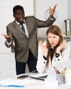 Angry man boss pointinting to misses in work to woman manager working Royalty Free Stock Photo