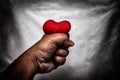 angry man crushing red heart in hand., unrequited love., love co