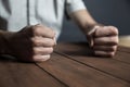 Angry man fists on the table Royalty Free Stock Photo