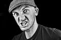Angry man in grey cap Royalty Free Stock Photo