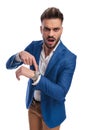 Angry man pointing his finger to watch and screaming Royalty Free Stock Photo