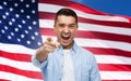 Angry man pointing on you over american flag Royalty Free Stock Photo