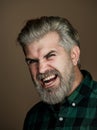 Angry Man. Portrait of a happy man over gray background. Fashion style portrait of handsome guy. Handsome young man on Royalty Free Stock Photo