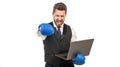 angry man punching with fist in boxing glove hold computer, anger Royalty Free Stock Photo