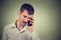 Angry man screaming on the mobile phone Royalty Free Stock Photo