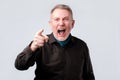 Angry man screaming, pointing index finger at you Royalty Free Stock Photo