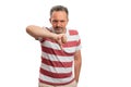 Angry man showing dislike gesture using thumb-down with copyspace Royalty Free Stock Photo
