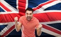 Angry man showing fists over brittish flag