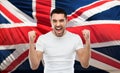 Angry man showing fists over brittish flag