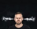 Angry man with smoke coming out from his ears. Royalty Free Stock Photo