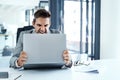Angry, man and stress with laptop in office frustrated with glitch, mistake or crisis. Anxiety, annoyed and male Royalty Free Stock Photo