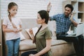 Angry Man Talking Phone and Mother Scolding Girl. Royalty Free Stock Photo