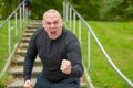 Angry man threatening the camera with his fist Royalty Free Stock Photo