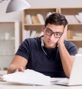 Angry man with too much paperwork to do Royalty Free Stock Photo