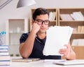 Angry man with too much paperwork to do Royalty Free Stock Photo