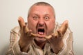 Angry man yelling at camera pointing with hands Royalty Free Stock Photo