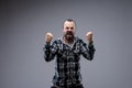 Angry man yelling and shaking his fists Royalty Free Stock Photo