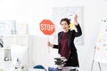 Angry manager holding stop sign and screaming Royalty Free Stock Photo