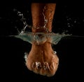 Angry mans fist punching water. Human power energy in water Royalty Free Stock Photo