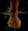 Angry mans fist punching water. Human power energy in water Royalty Free Stock Photo