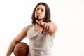 Angry masculine white man pointing his finger to the camera while holding basketball ball in his arm. Challenge concept Royalty Free Stock Photo