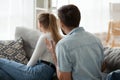 Angry man shouting at woman, sitting separately, relationships problem