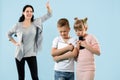 Angry mother scolding her son in living room at home Royalty Free Stock Photo