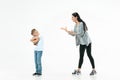 Angry mother scolding her son in living room at home Royalty Free Stock Photo