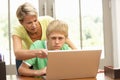 Angry Mother And Teenage Son Using Laptop At Home Royalty Free Stock Photo