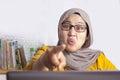 Angry muslim boss businesswoman screaming and pointing shows disappointed gesture