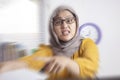 Angry muslim boss businesswoman screaming and pointing shows disappointed gesture