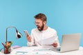 Angry nervous man office worker in white shirt screaming looking at smartphone display, skipping important event through lot of