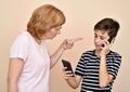 Mother scolding her son with two smarthphones Royalty Free Stock Photo