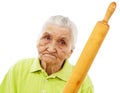 Angry old woman threatening with a rolling pin Royalty Free Stock Photo